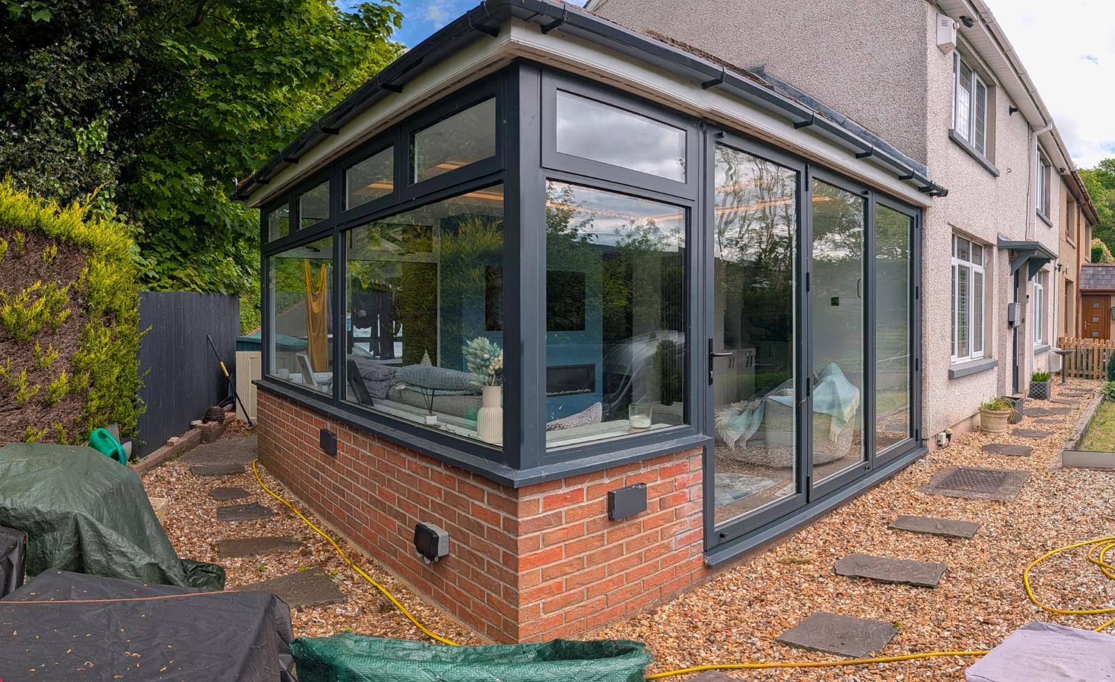 Anthracite aluminium orangery extension fitted to a South Wales home