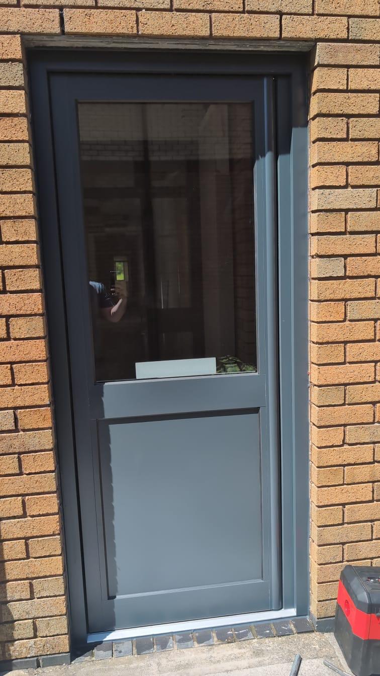 Aluminium Doors installation by Essential Glazing Products