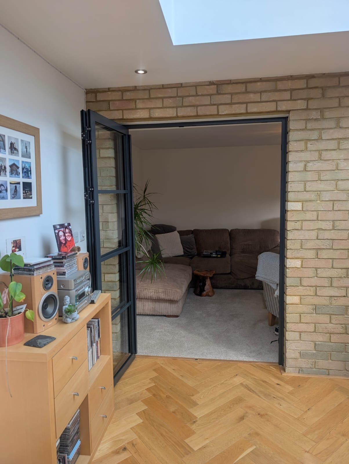 Aluminium Bi-folds installation by Essential Glazing Products